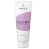 Tube of Image Essentials Body Spa exfoliating body scrub; white tube with a purple curved label.