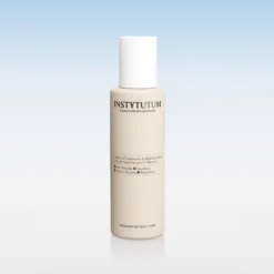 Beige skincare bottle with a white cap centered on a pale blue gradient backdrop; label reads 'Advanced Retinol Toner' ( toner ).