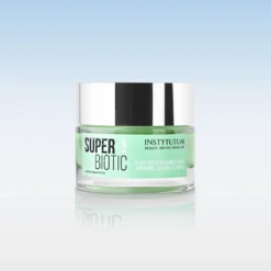 Jar of Instytutum Super Biotic plant-based ceramide cream with a silver lid on a reflective surface.