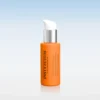 Orange skincare bottle with white pump dispenser and silver collar against a pale gradient background.