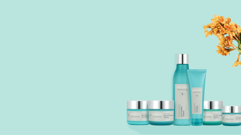 Promotional display of turquoise Artistry skincare bottles and jars arranged on a mint background with yellow flowers in the corner.