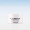 White cosmetic jar labeled 'Flawless Pads' with product description in black text, set against a pale gradient background (skincare product image). See-through reflection below the jar.