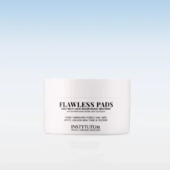 White cosmetic jar labeled 'Flawless Pads' with product description in black text, set against a pale gradient background (skincare product image). See-through reflection below the jar.