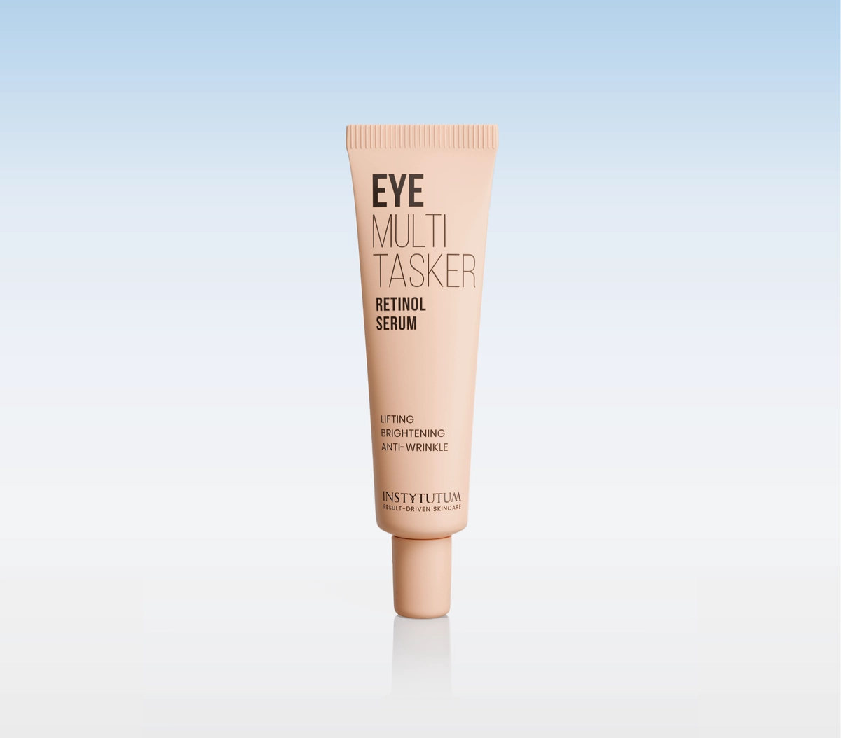 Beige tube of Eye Multi Tasker Retinol Serum standing upright on a reflective surface with a blue gradient background.