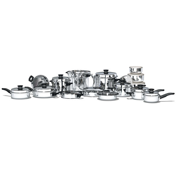 Full set of shiny stainless steel pots and pans with lids arranged in a row on a white background, ready for cooking.