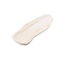 A diagonal swipe of white cream on a white background, resembling lotion or moisturizer