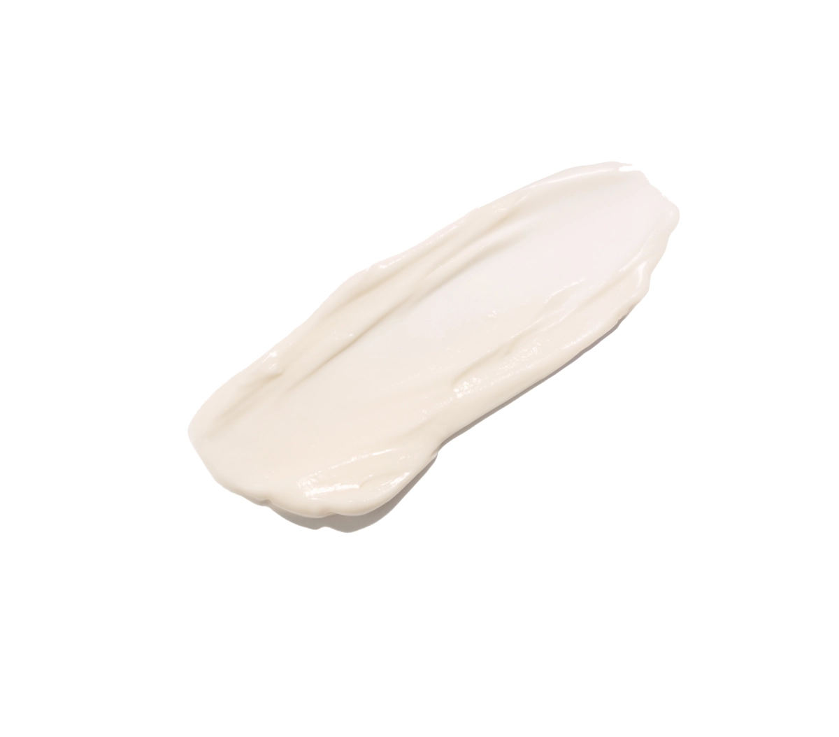 A diagonal swipe of white cream on a white background, resembling lotion or moisturizer