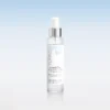 Clear cylindrical spray bottle with a silver pump cap centered on a pale blue gradient background, label shows 'HYDRA MIST' and 'ULTRA-HYDRATING TONER'
