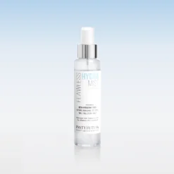 Clear cylindrical spray bottle with a silver pump cap centered on a pale blue gradient background, label shows 'HYDRA MIST' and 'ULTRA-HYDRATING TONER'