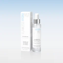 Bottle and box of Instytutum Flawless Hydra Mist on a pale blue gradient background.