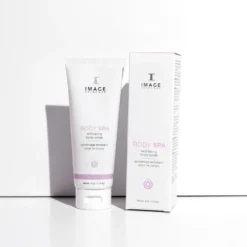 White tube and box of IMAGE Skincare Body Spa exfoliating body scrub on a white surface.