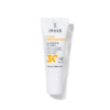 Narrow white lip balm tube labeled 'Daily Prevention' with SPF 30 on the front, standing upright and casting a soft shadow.