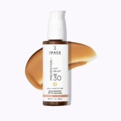 Bottle of Image Skincare Prevention+ sun serum SPF 30 with a white pump, orange-tinted sunscreen swash behind it