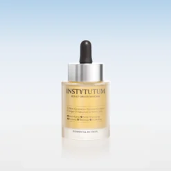 Bottle of Instytutum Powerful Retinol skincare serum with dropper against a pale gradient blue background, front label visible