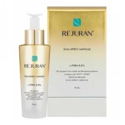 Rejuran Dual Effect Ampoule bottle beside its gold box, teal leaf logo visible.