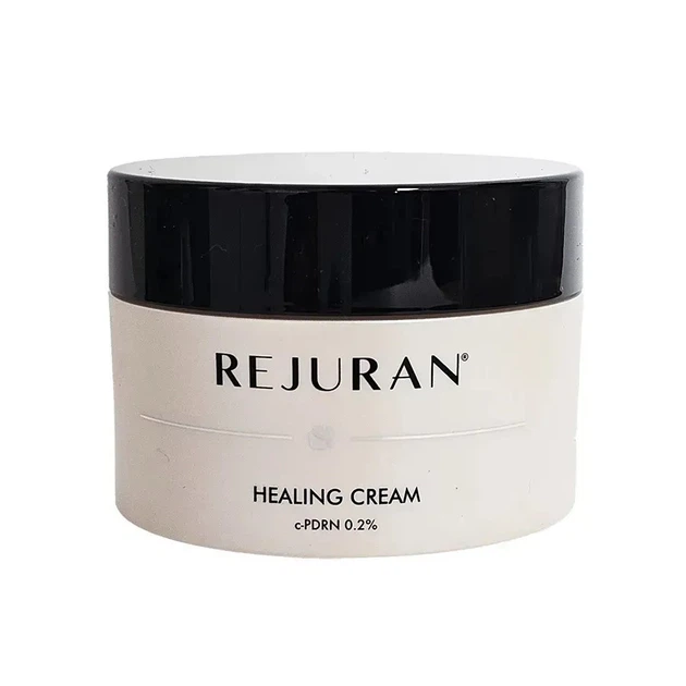 Cosmetic jar of Rejuran Healing Cream with a black lid on a white background