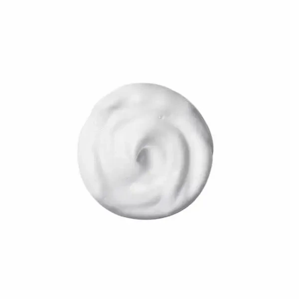 White whipped cream swirl on a plain white background, circular and smooth in texture.