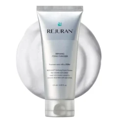 Tube of REJURAN Refining Foam Cleanser with a soap-like foam backdrop on a white background, emphasizing the skincare product