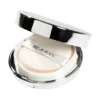 Open silver makeup compact with round powder puff labeled REJURAN inside