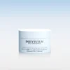 Light blue cosmetic jar labeled Instytutum with 'Resurfacing Multi-Acid Pads' against a gradient background.