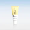 Tube of sunscreen with SPF 50, yellow to white gradient, standing upright on a reflective surface.
