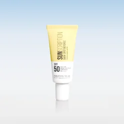 Tube of sunscreen with SPF 50, yellow to white gradient, standing upright on a reflective surface.