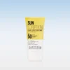 Tube of Instytutum Sun Scription Dark Spot Defence SPF 50 sunscreen standing upright against a pale blue gradient background.