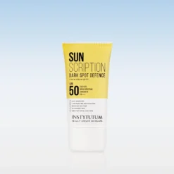 Tube of Instytutum Sun Scription Dark Spot Defence SPF 50 sunscreen standing upright against a pale blue gradient background.