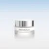 Silver-capped jar of Instytutum Truly-Transforming Brightening Eye Cream on a white reflective surface