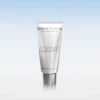 Silver skincare tube with INSTYTUTUM branding on a reflective surface against a blue gradient background, product displayed upright.