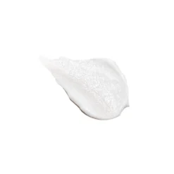 Dollop of white facial cream or lotion on a plain background, showing its smooth texture